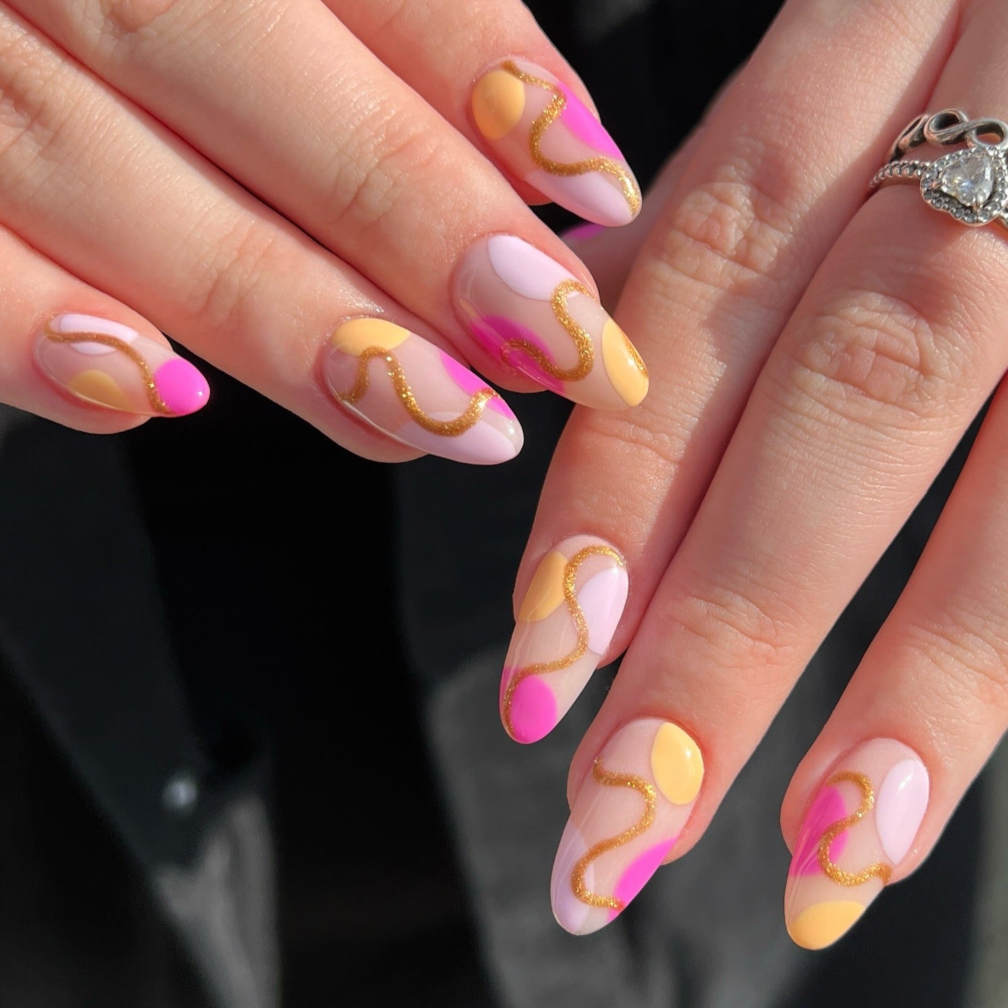 3. Abstract Gold Lined Swirl Nails (Yellow and Pink Nail Ideas)