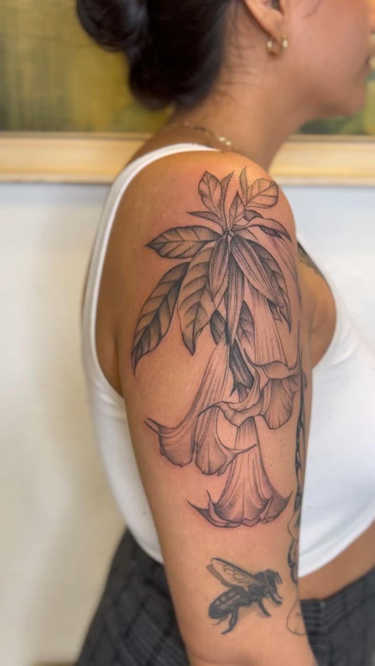 Brugmansia tattoo| Fineline Angel Trumpet tattoo| Draping floral tattoo work| Flower tattoo on arm