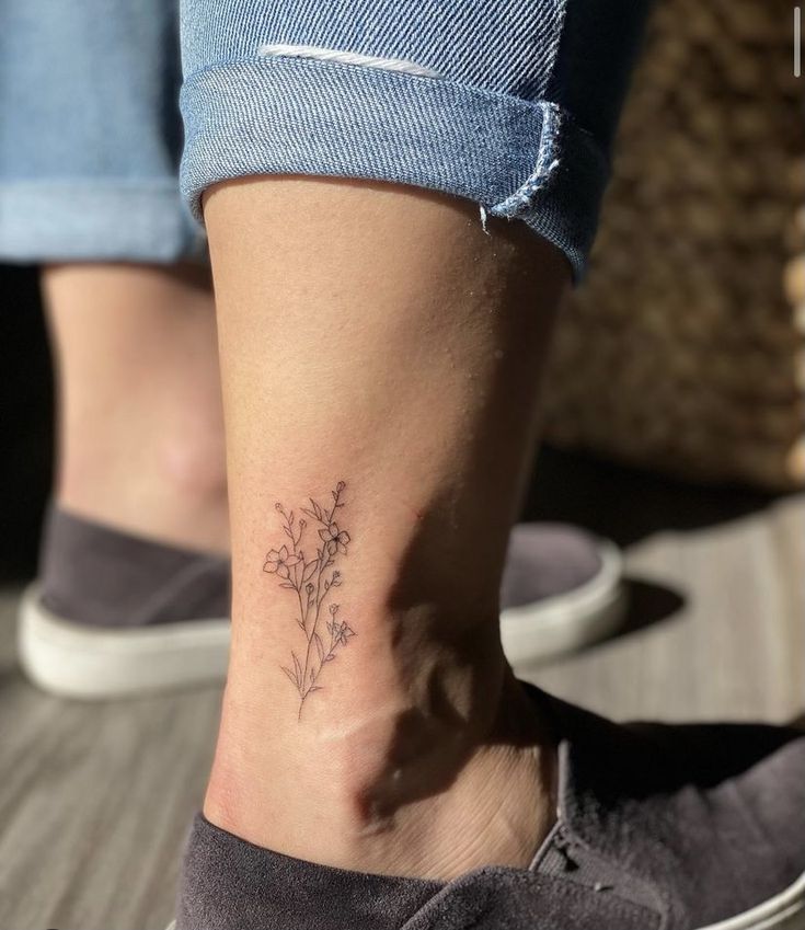 Floral ankle tattoo