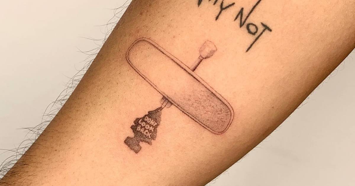 Micro-realistic rear view mirror tattoo located on the
