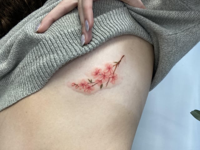Ribcage Cherry Blossom Tattoo done by Da-An (visiting) at Noble ...