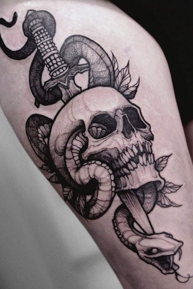 Skull and dagger tattoo by Tessa Von