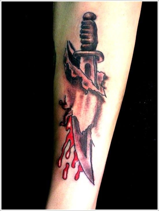 Realistic dagger has pierced skin and blood drops forearm tattoo