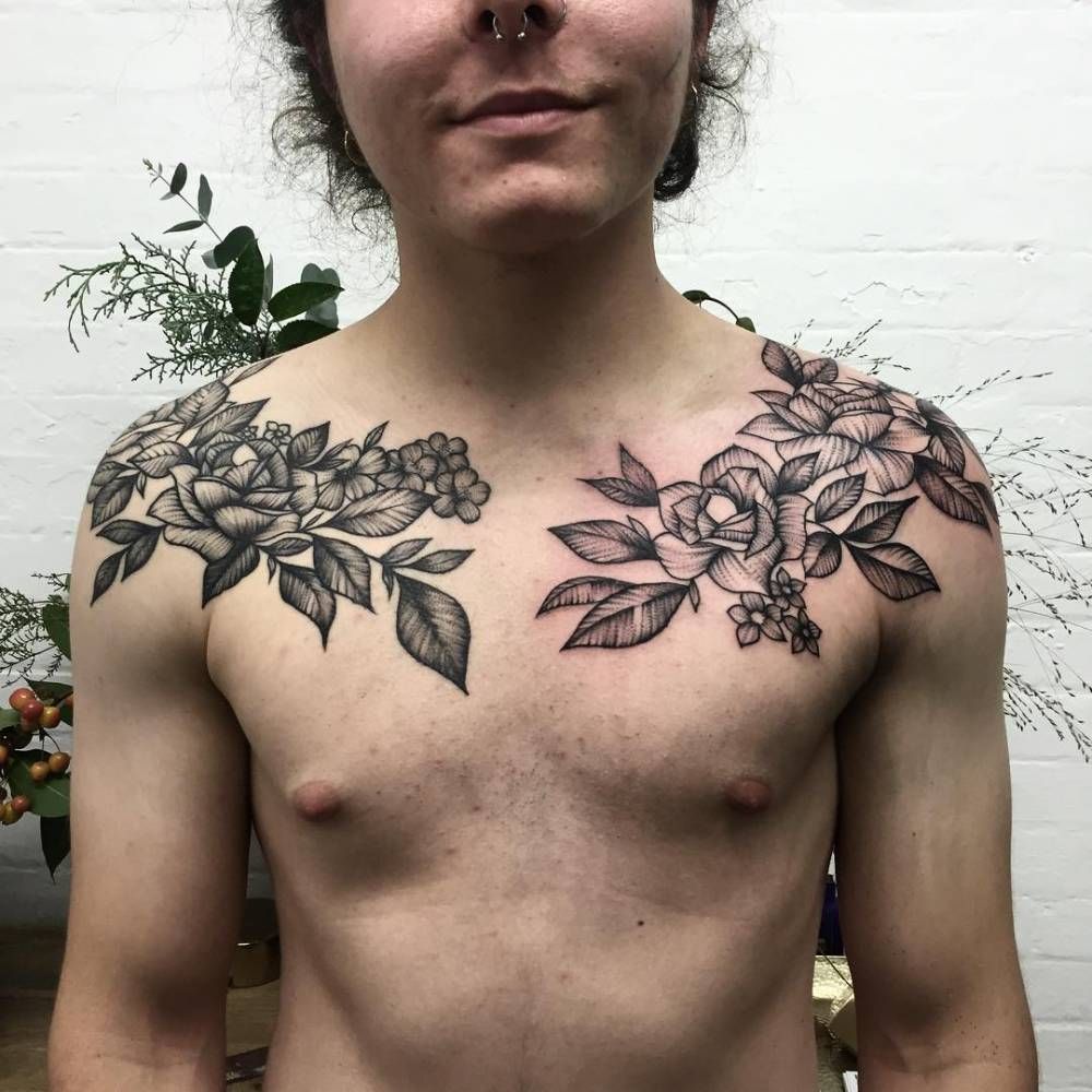 Flower bouquet tattoo on shoulders and chest.
