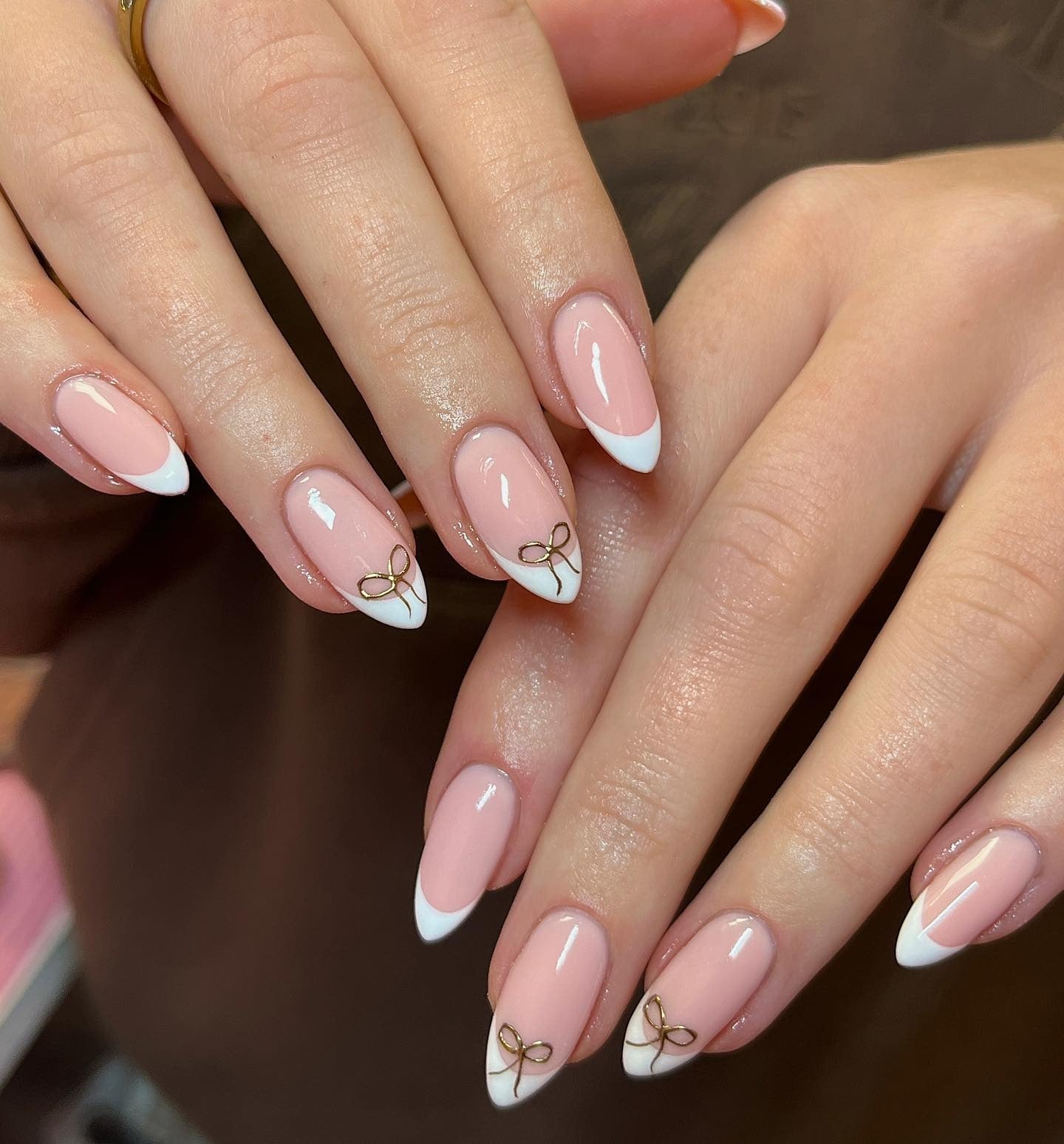 1. White French Almond with Gold Ribbon Accents (French Tip Nail Ideas)