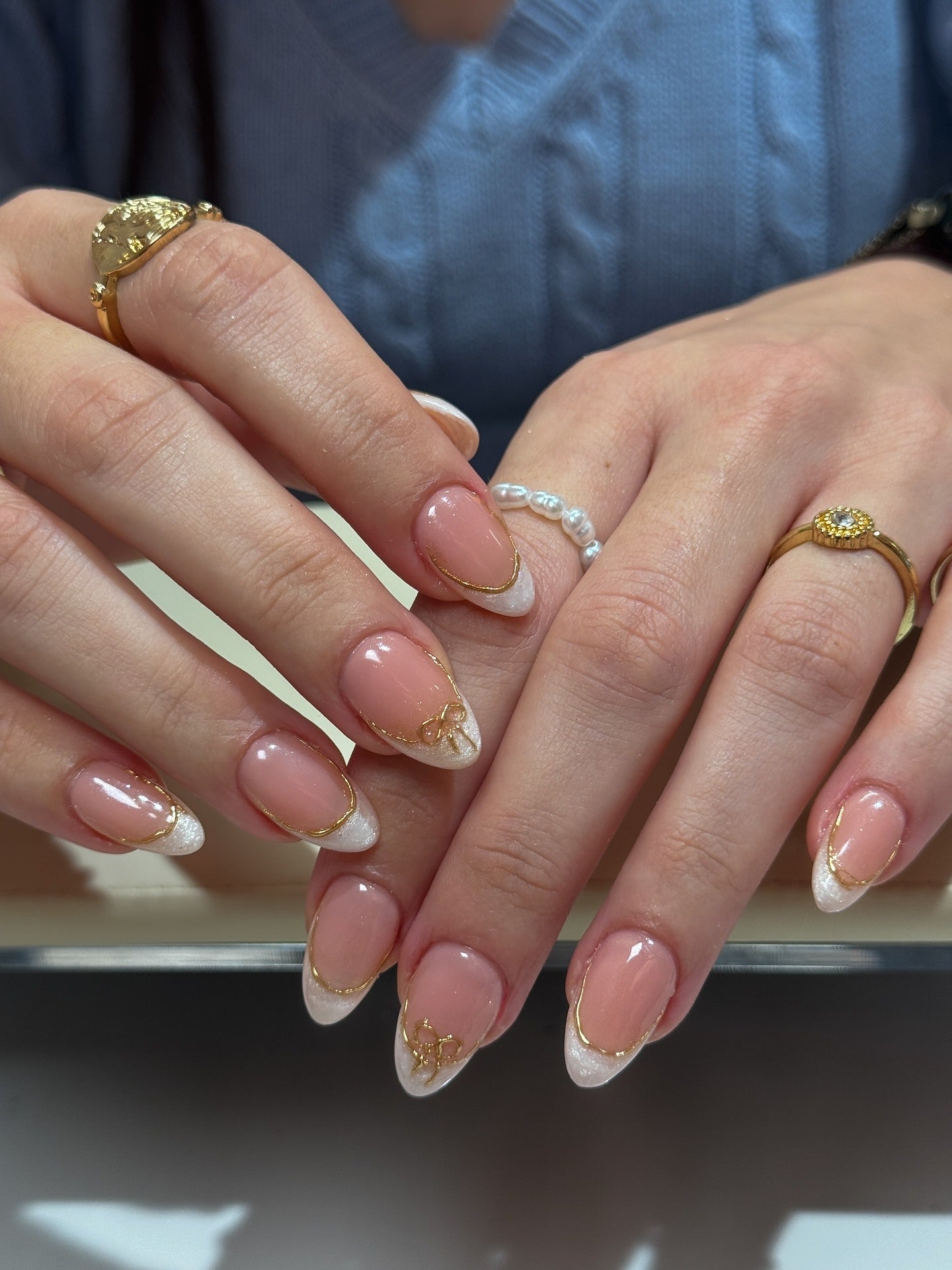13. Champagne Sparkle French Tips with Gold Outline (French Tip Nail Ideas)