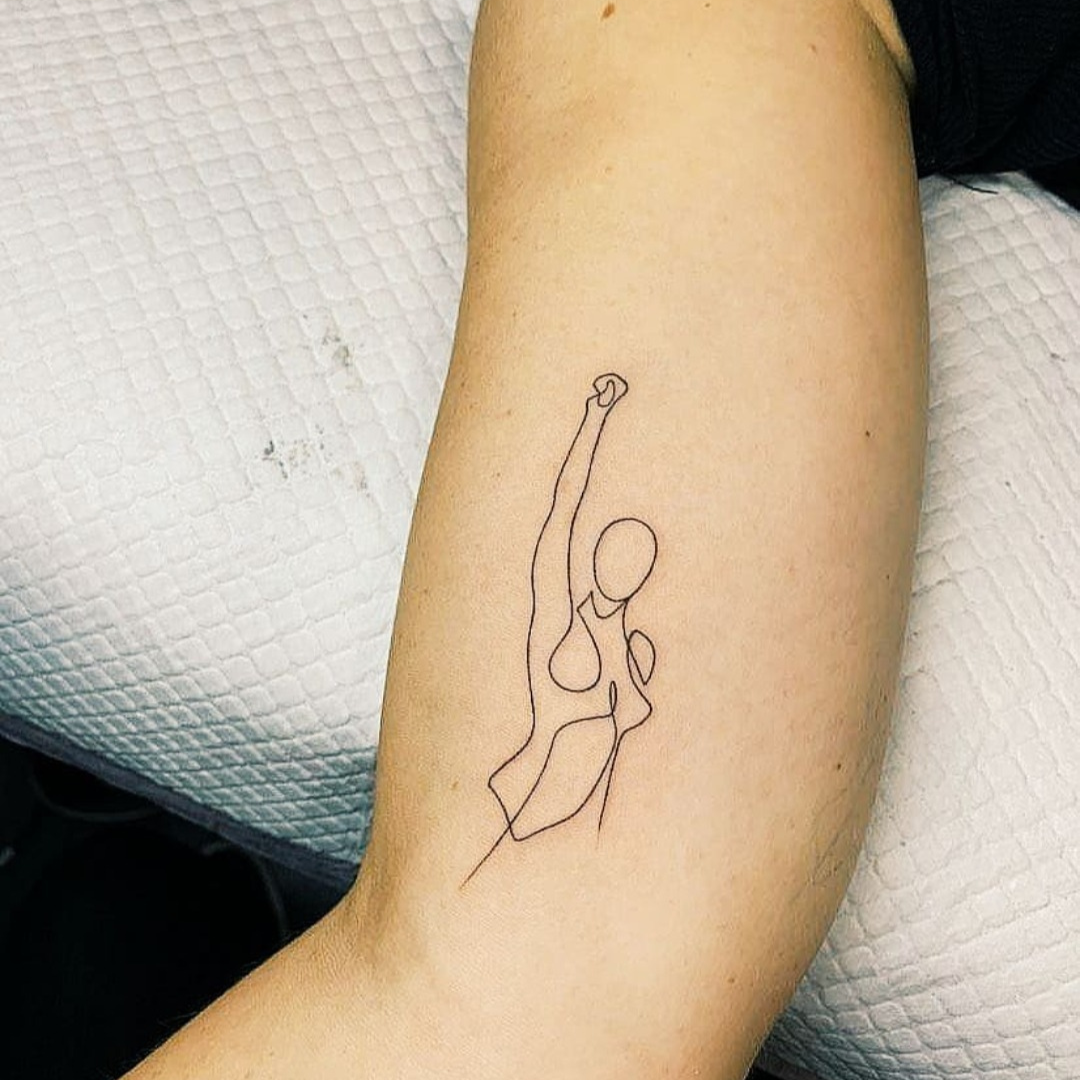 Empowering line art tattoo