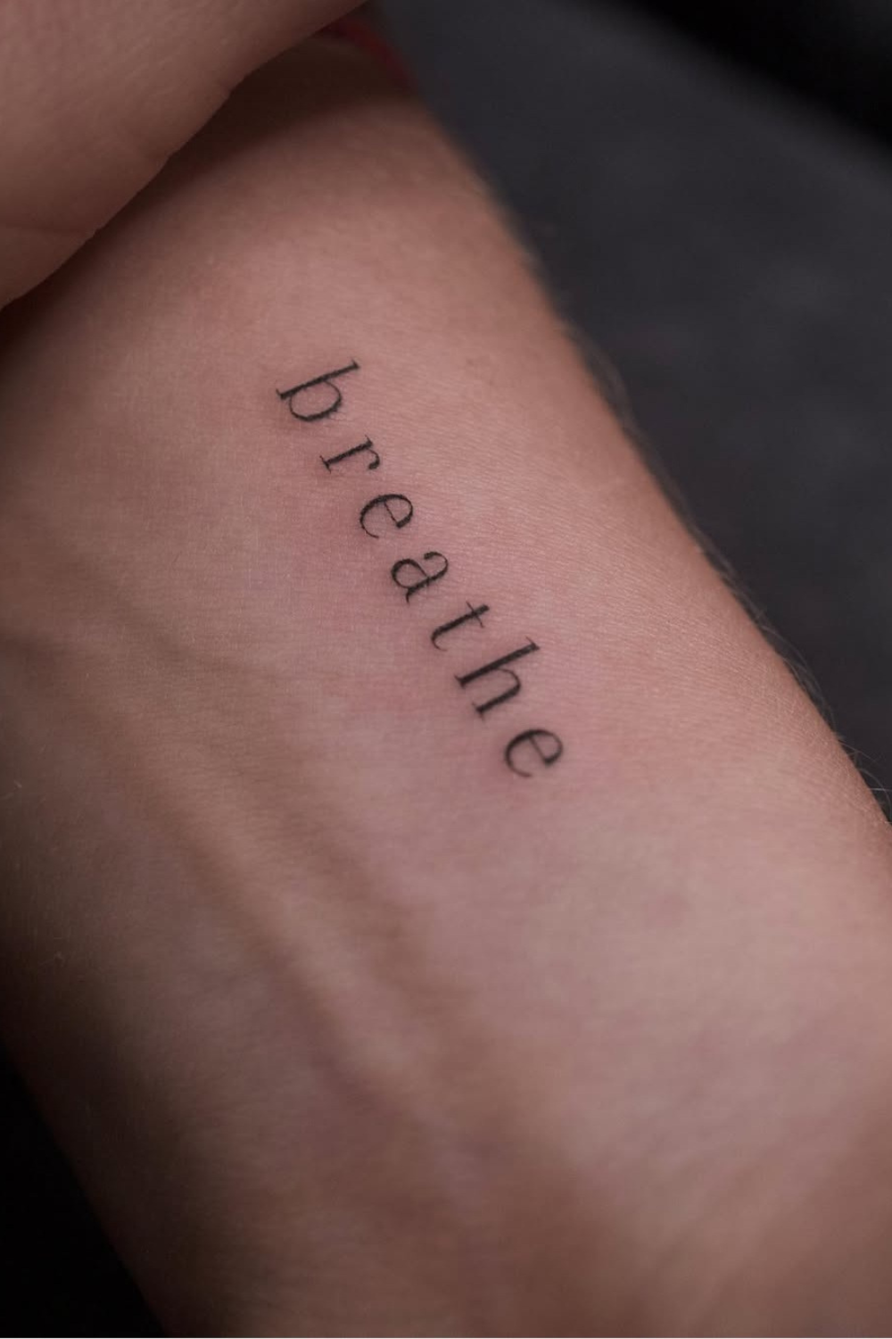 One Word Breathe tattoo