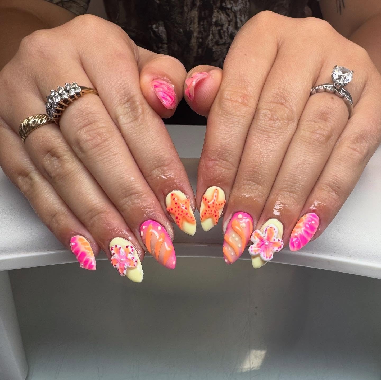 8. Neon Coral Starfish and Floral Nails (Beach Nail Ideas)