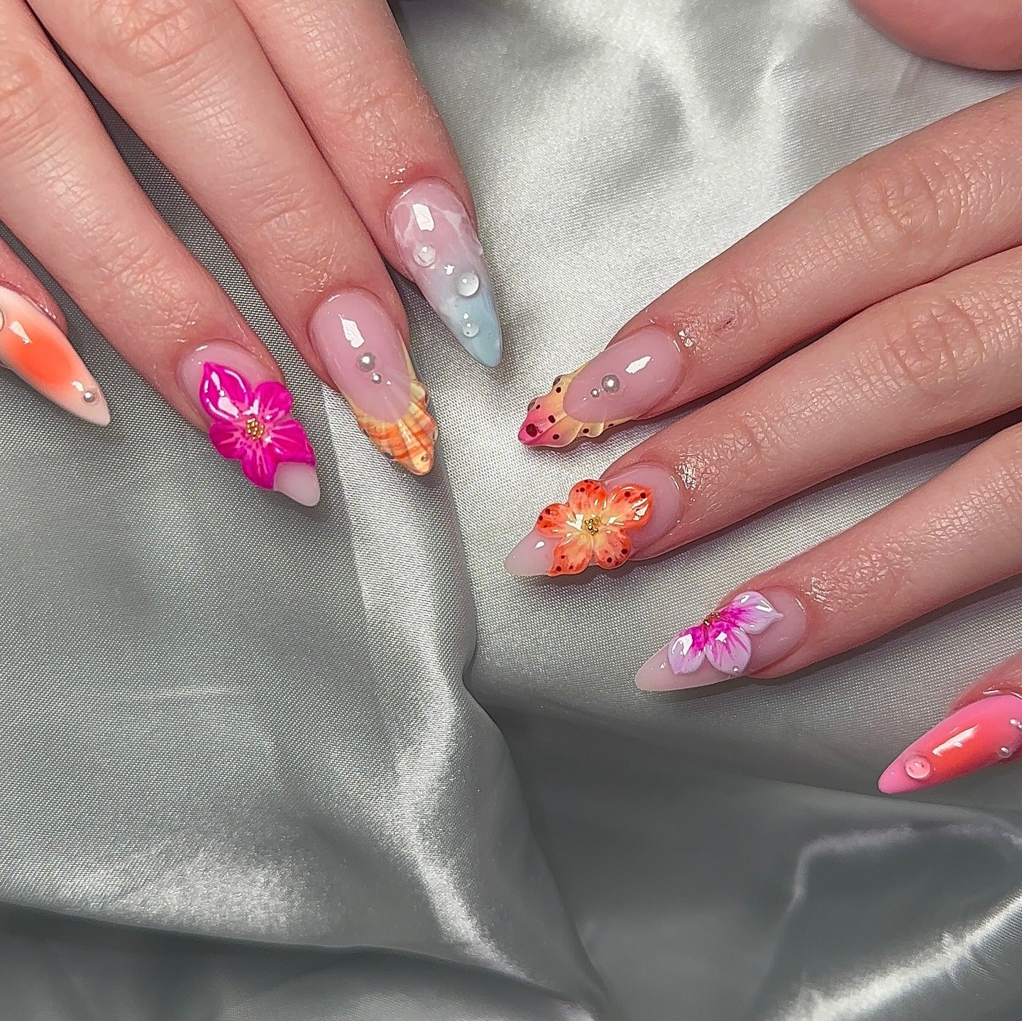 17. Sunset Hibiscus and Shell Nails (Beach Nail Ideas)