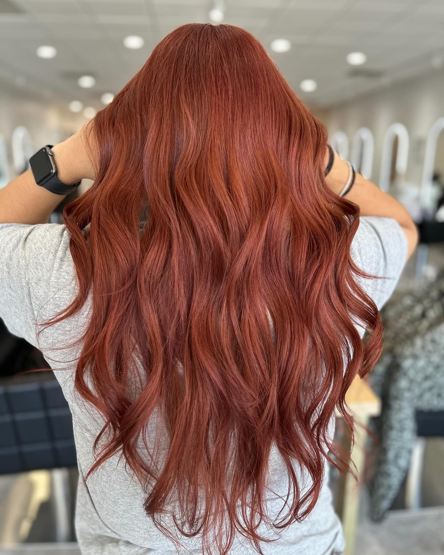 7. Glossy Long Layers in Vibrant Copper Red (Red Copper Hair Color)