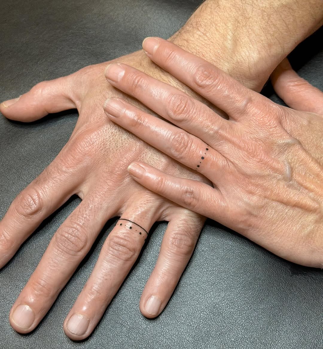 Elegant minimalist wedding ring tattoo design