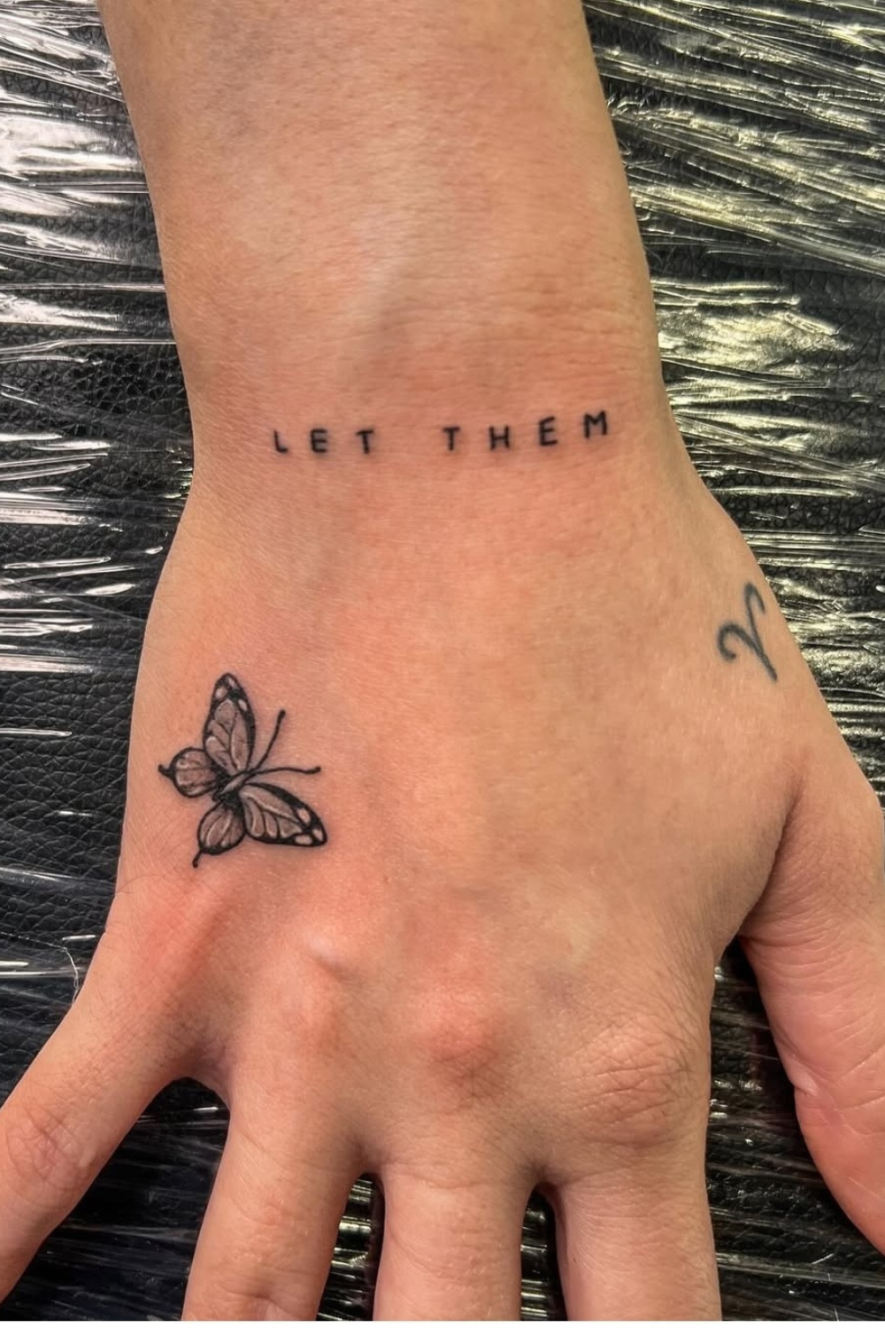 Let Them Micro Hand Tattoo