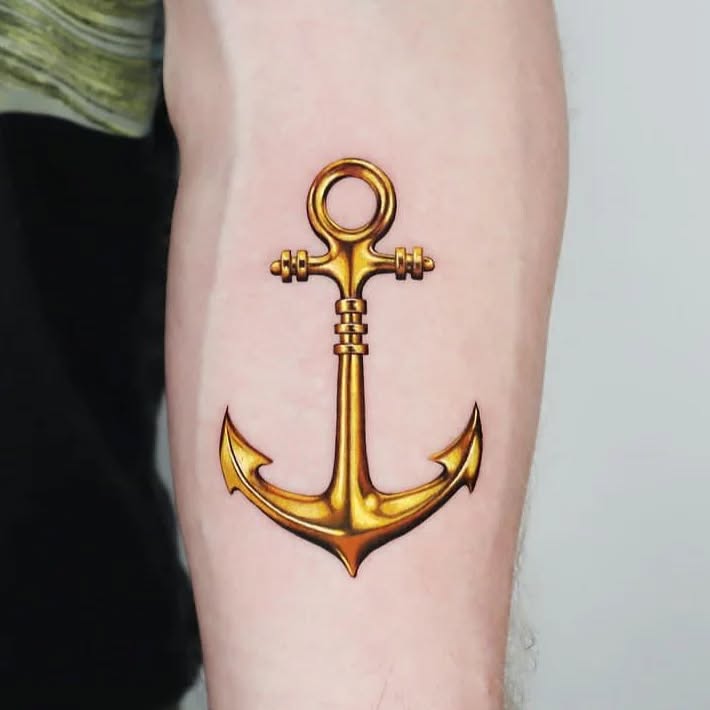Stylish golden anchor tattoo design on arm