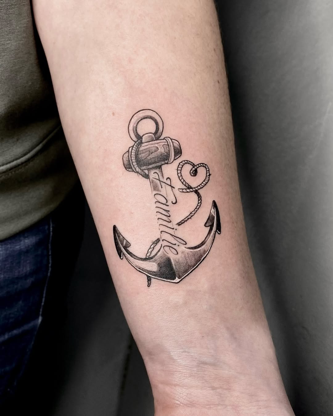 Stylish anchor tattoo emphasizing family connection