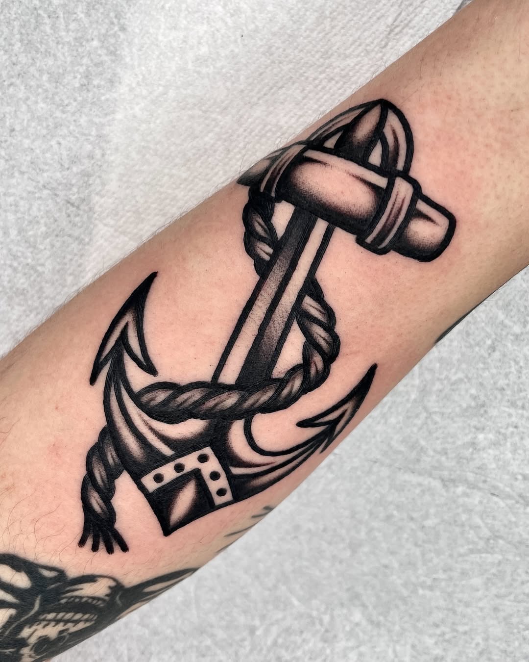 Stunning anchor tattoo design with rope details