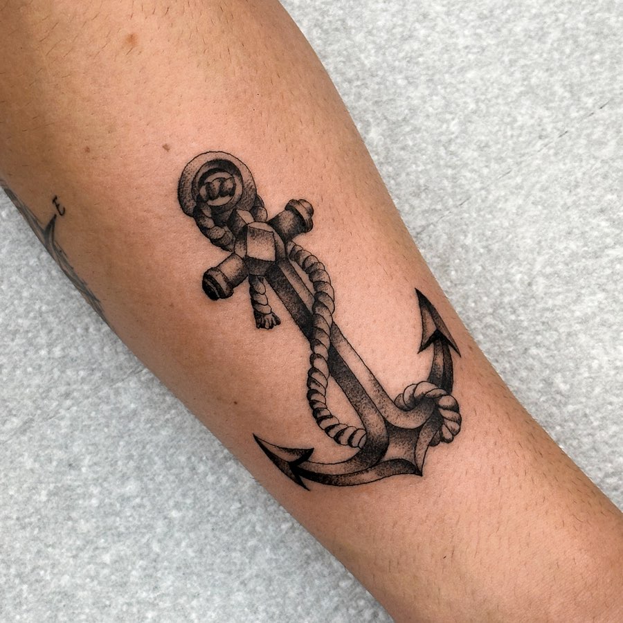 Classic anchor tattoo with intricate rope details