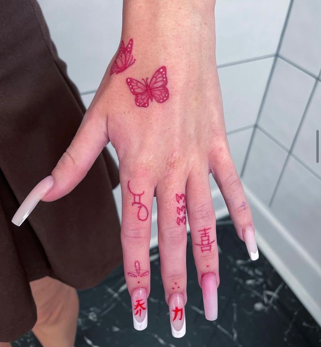 Red Fingers Hand Tattoo