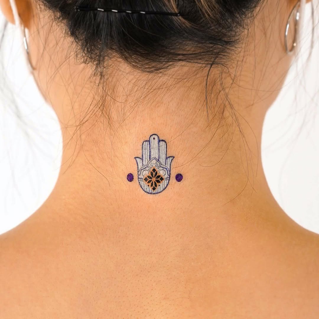 Symbolic strength through a hamsa tattoo