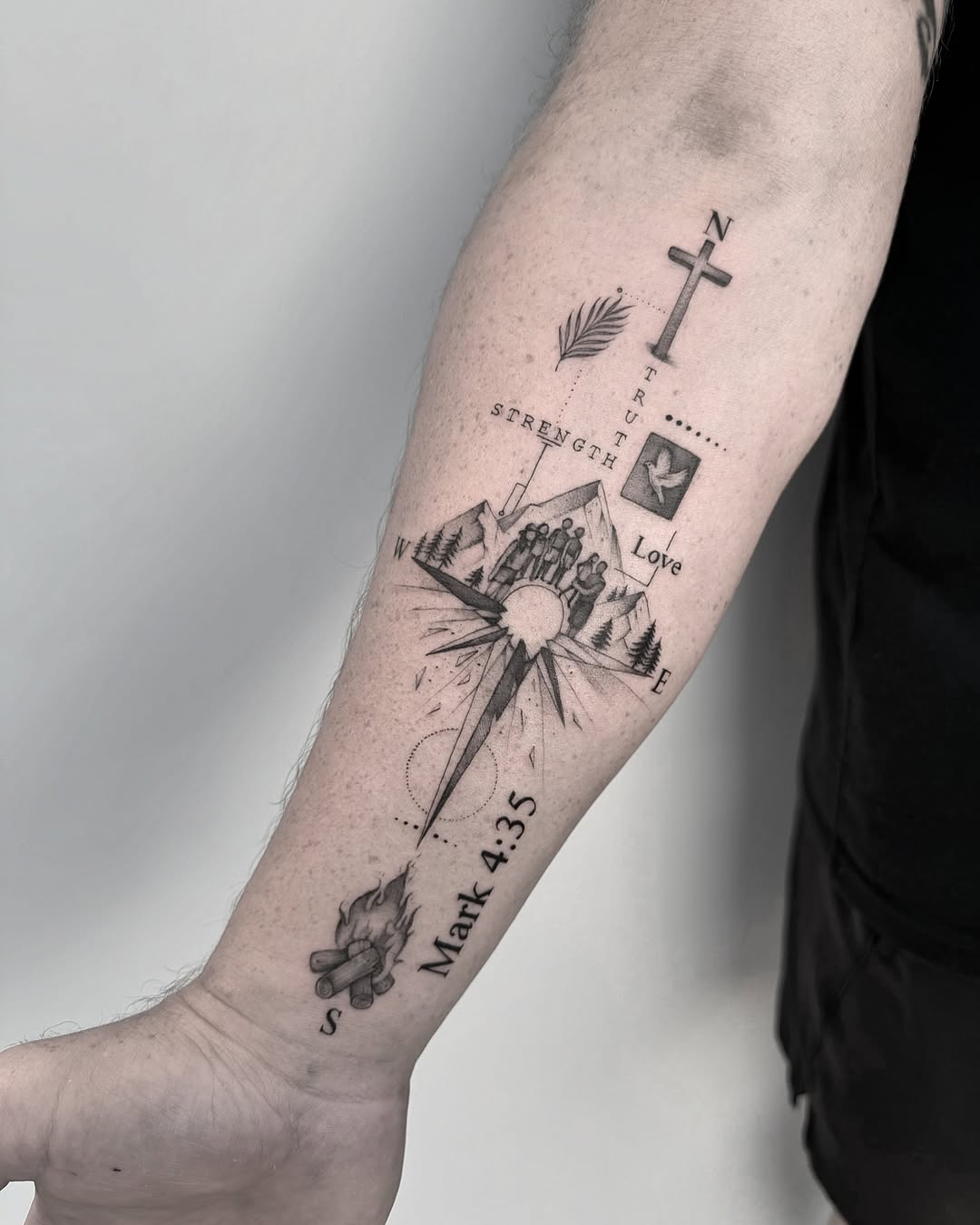 Symbolic strength tattoo with family and faith themes