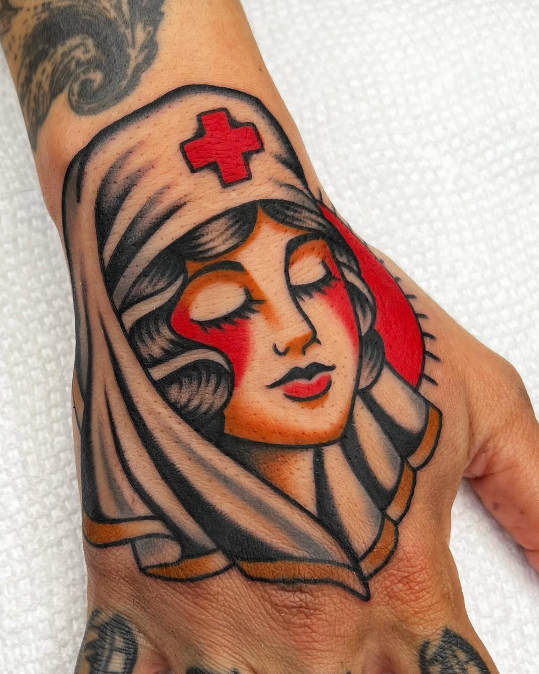 A vintage nurse tattoo with a classic touch