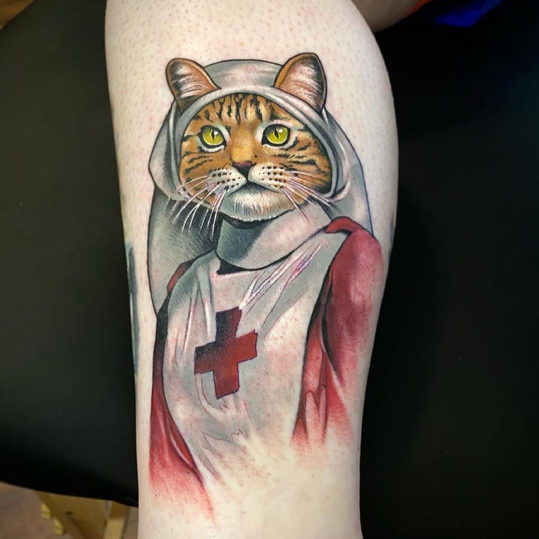 Unique feline-themed nurse tattoo design