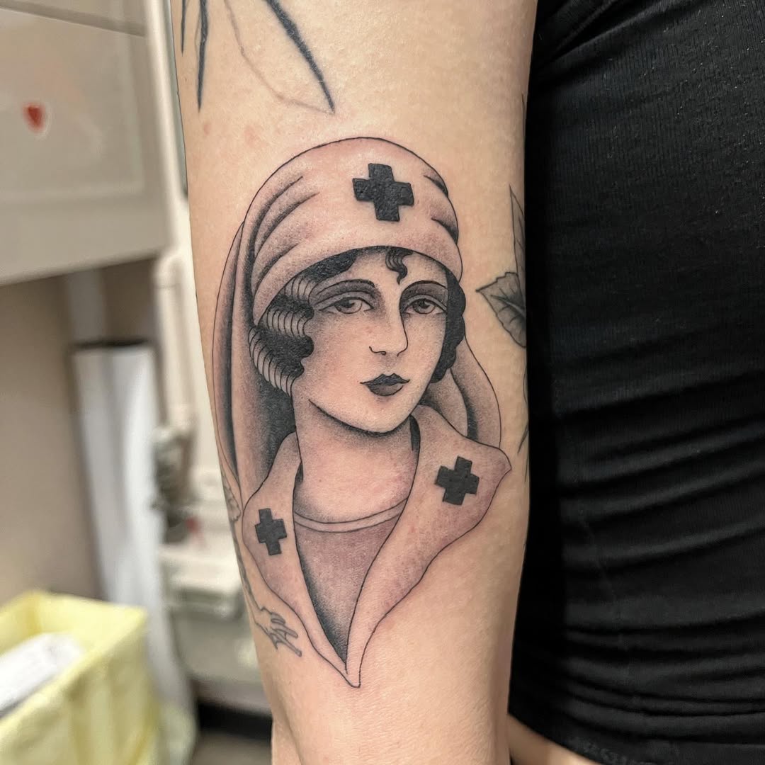 Classic nurse tattoo with vintage flair