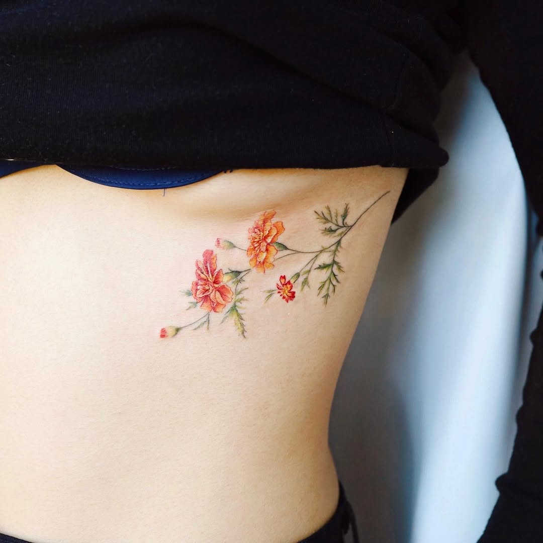 Vibrant floral underboob tattoo design
