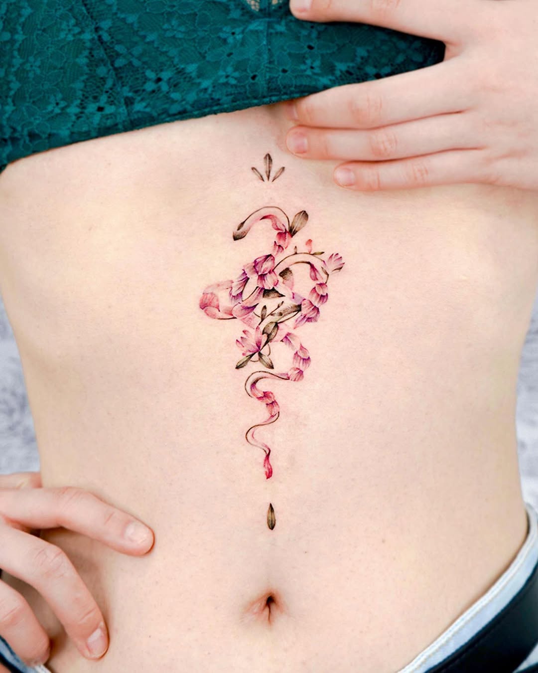 Stunning floral underboob tattoo design