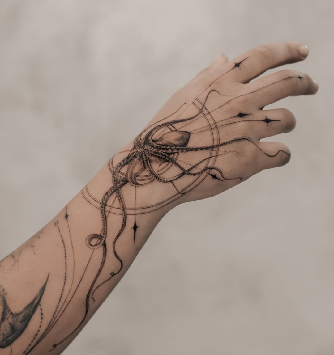 Stunning minimalist octopus tattoo on forearm