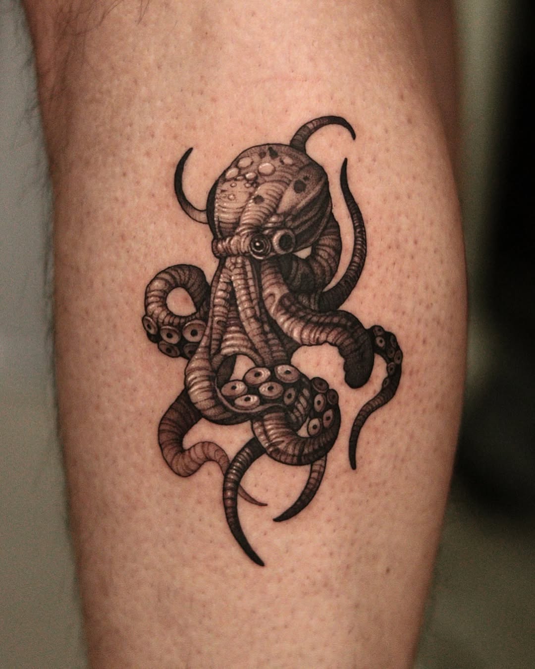 Intricate black ink octopus tattoo design