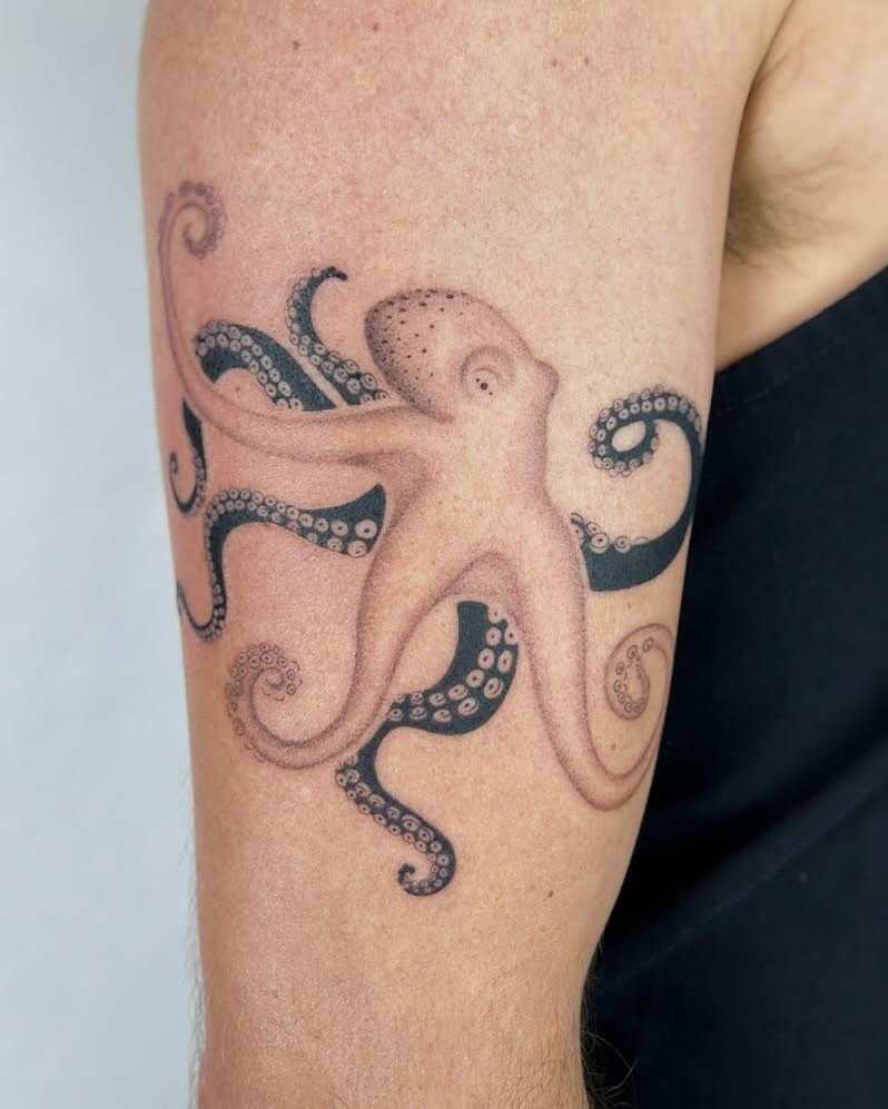 Intricate black outline octopus tattoo design