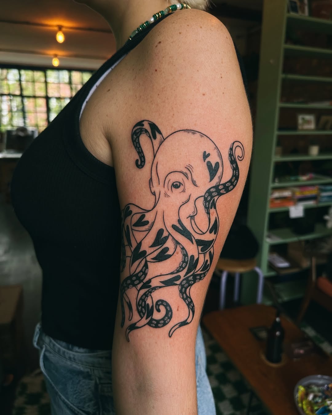 Stylish octopus tattoo with organic elements