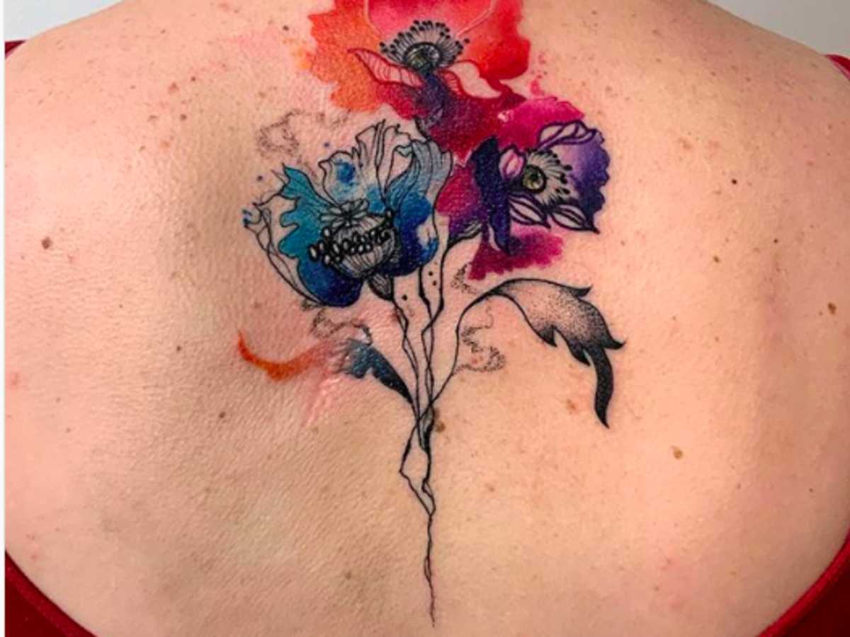 Watercolor wash tattoo cover up design blending soft colors