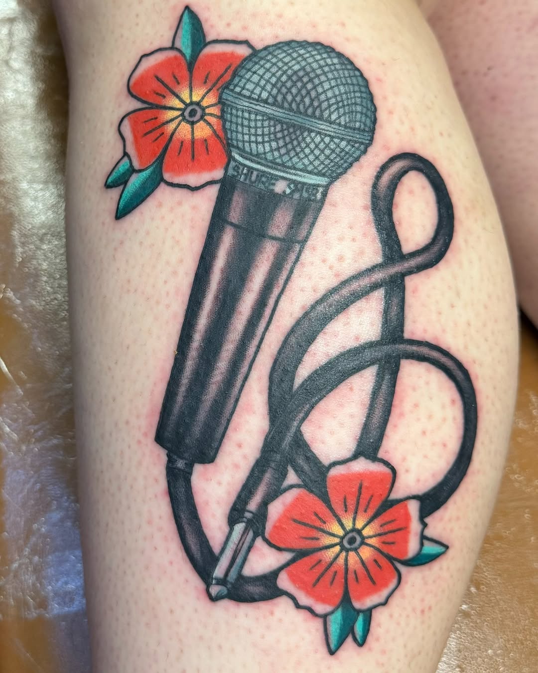 Stylish Microphone Tattoo Surrounded by Blooms
