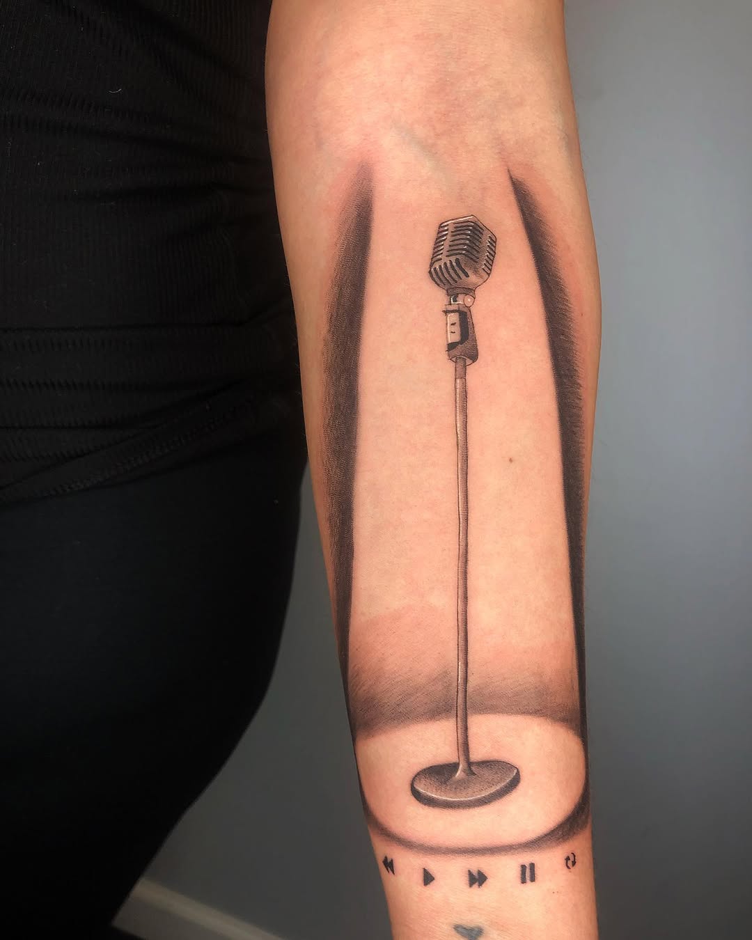 Realistic microphone tattoo with shadow details