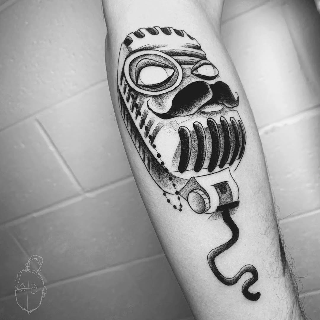 Stylish vintage microphone tattoo with mustache
