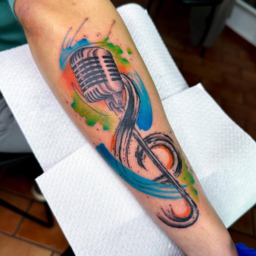 Vibrant microphone tattoo with musical flair