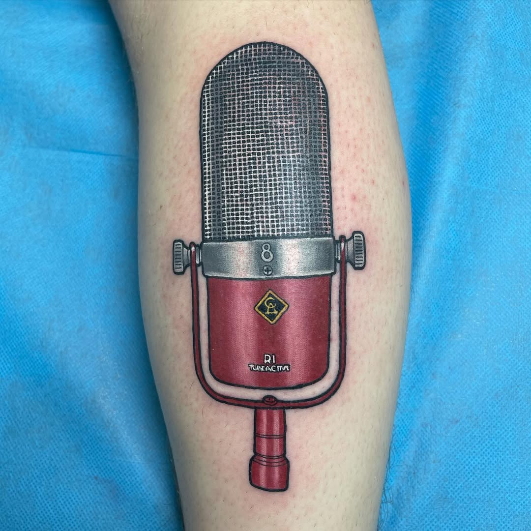 Detailed microphone tattoo showcasing vintage design