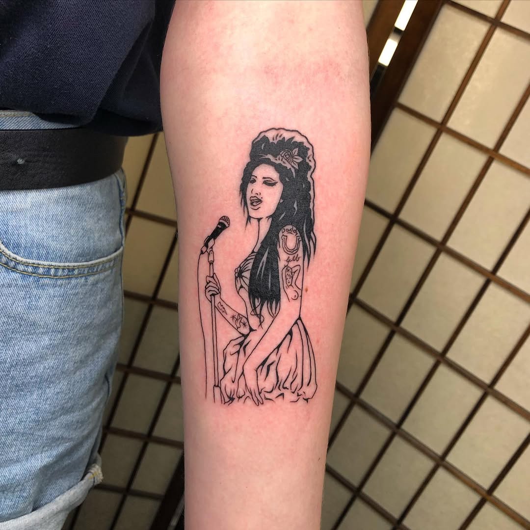 Stunning microphone tattoo of a talented singer