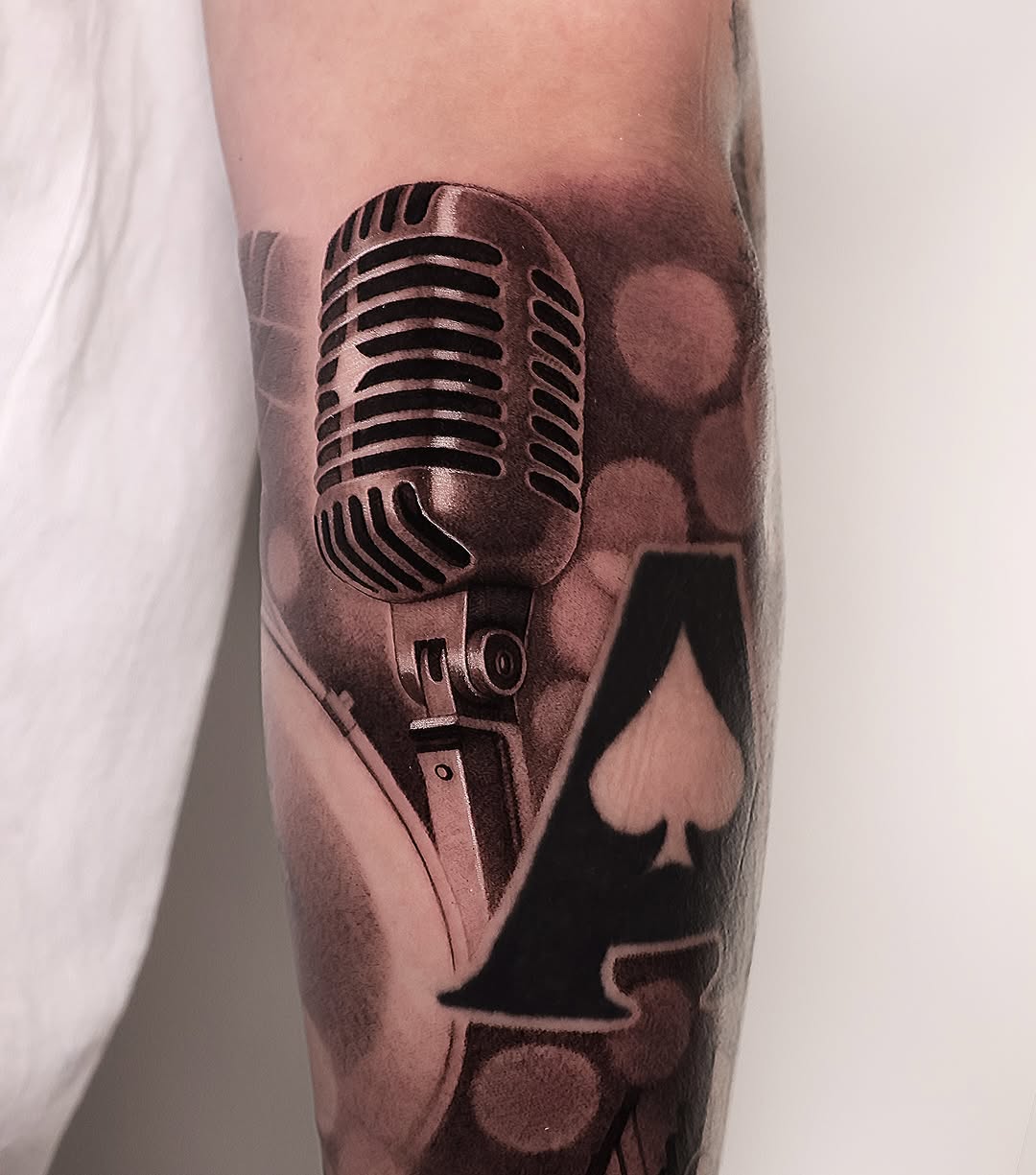 Realistic microphone tattoo with card details