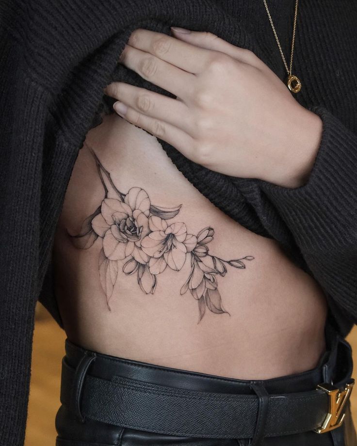 Delicate Flower Rib Tattoo Ideas