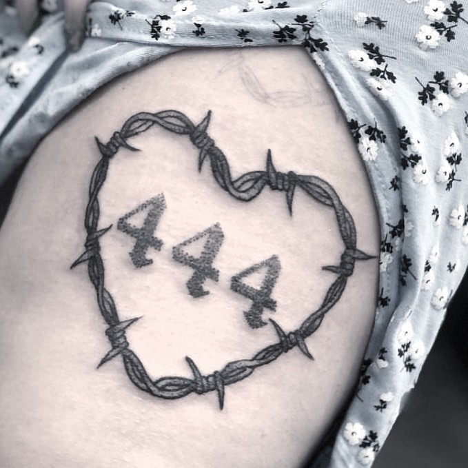 Unique heart-shaped 444 tattoo design