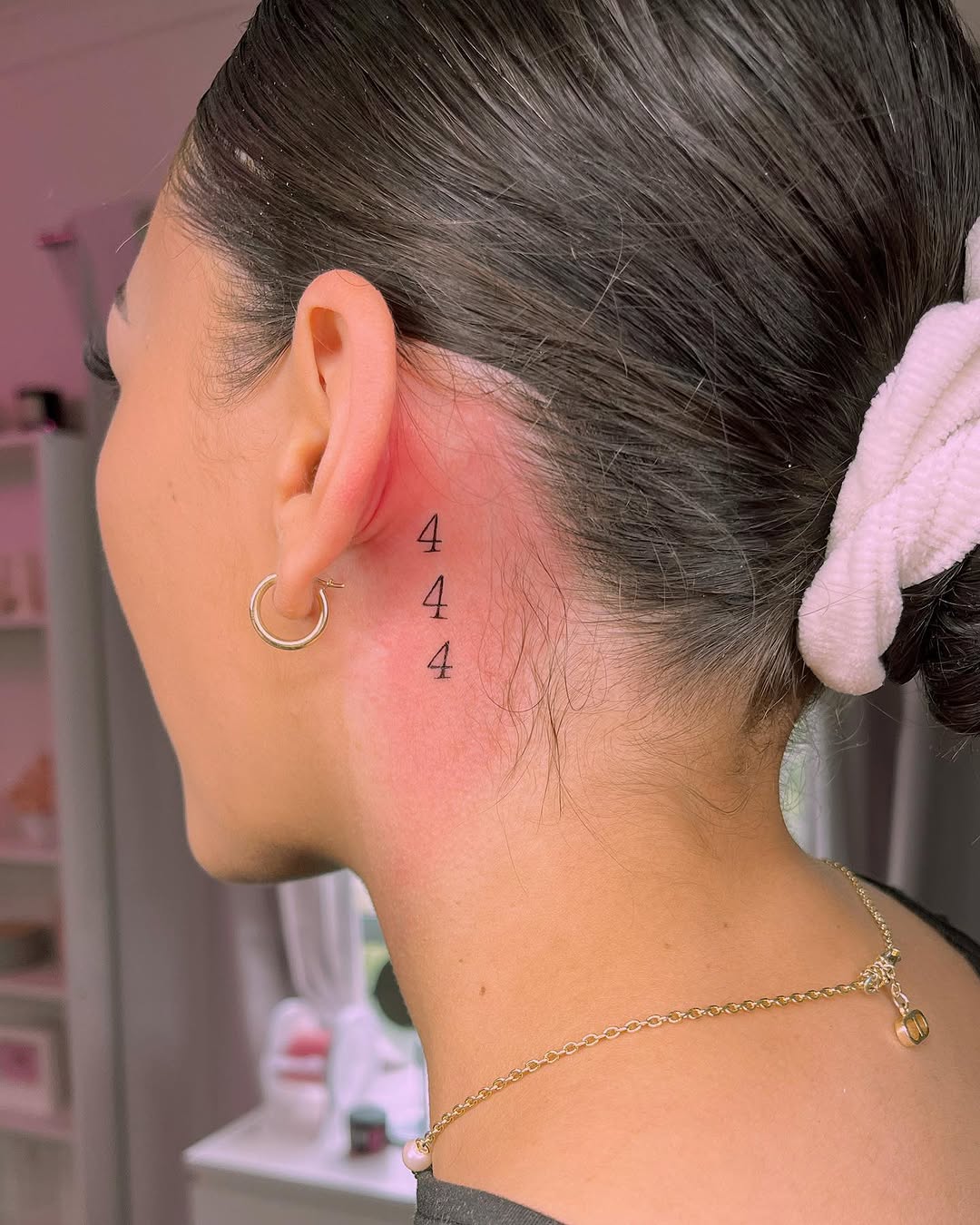 Delicate 444 tattoo behind the ear