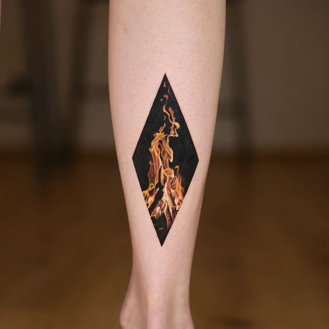 Bold flames within a diamond tattoo design
