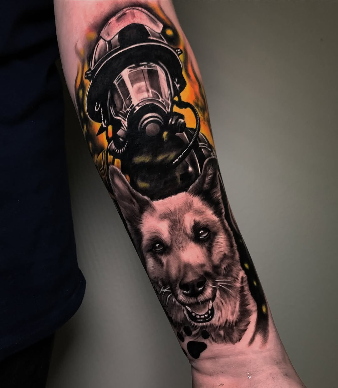Firefighter tattoo featuring a loyal companion