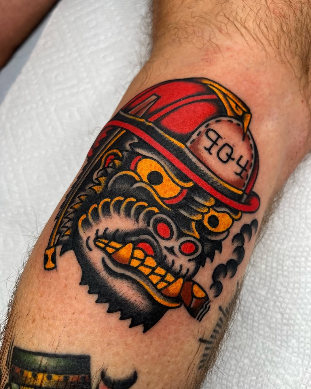 Bold firefighter tattoo with striking colors