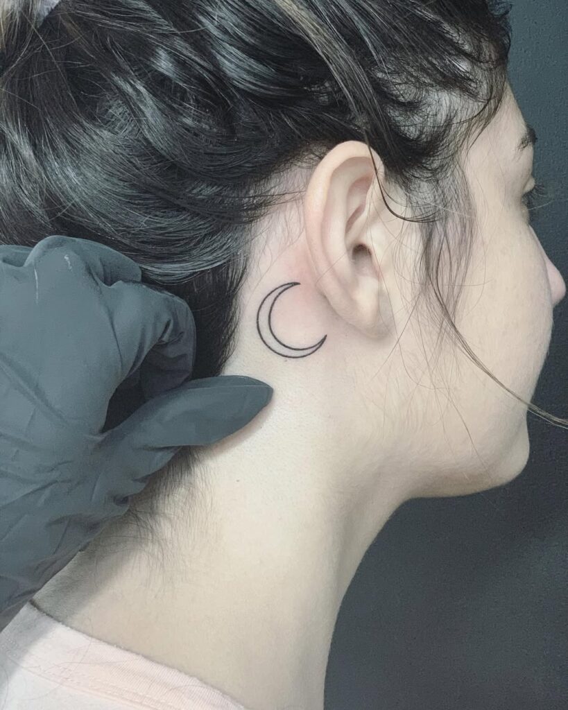 Crescent Moon Behind The Ear Tattoo