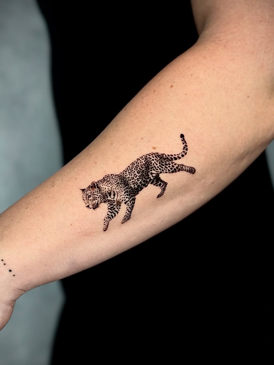 Dynamic Leopard Tattoo: A Symbol of Grace