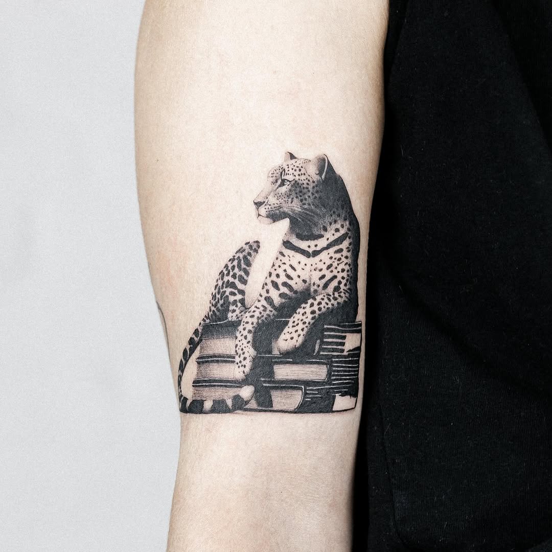 A Leopard Tattoo with Books Design Inspiration